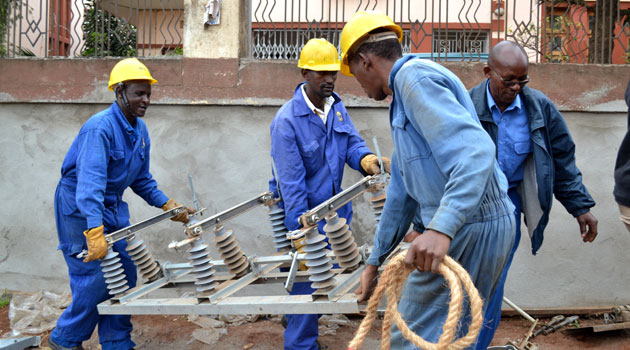 Kenya Power technicians at work. The firm has a Network Facility Provider – Tier 2 License issued by the  Communications Authority of Kenya (CA) in 2010.