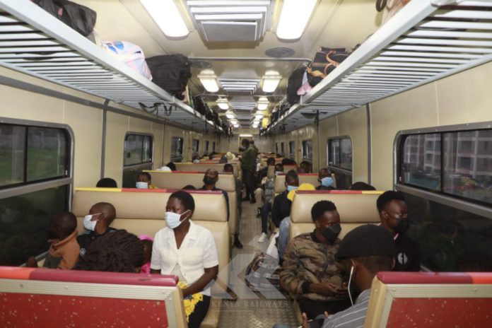 Passengers on the Nairobi-Kisumu train on December 17, 2021. Kenya Railways Managing Director Philip J. Mainga oversaw the departure from Nairobi of the first train - dubbed the Kisumu Safari Train. [Photo/ Kenya Railways]