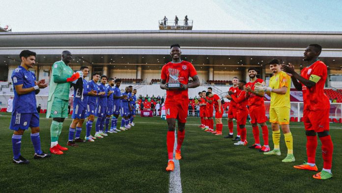 Michael Olunga poses with his Asian Champions League (ACL) top-scorer award as both sets of players mounted a guard of honor for him during a league match on January 4, 2022. [Photo/ @OgadaOlunga]