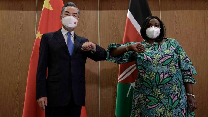 China's Foreign Minister Wang Yi (L) with his Kenyan counterpart, Raychelle Omamo (R) at the Sarova Whitesands Hotel in Mombasa where they met for a bilateral meeting on January 6, 2022. [Photo/ Tony Karumba/AFP]