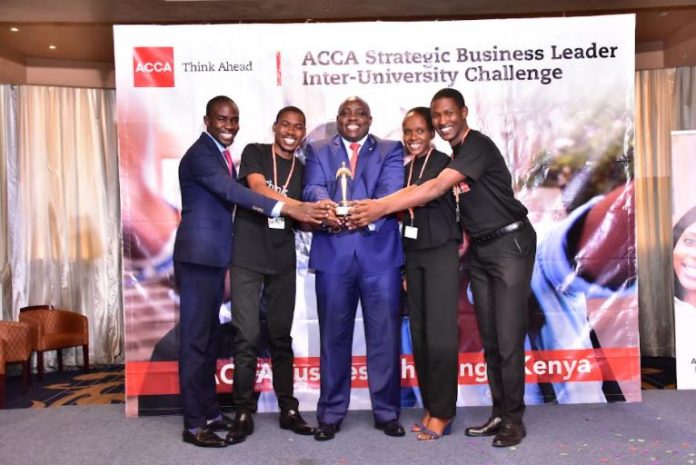 ACCA Head of Kenya & Tanzania Steve Obuogo(L),HELB CEO Charles Ringera (C) celebrate with JKUAT-Team Veex Strategia who won the overall award of ACCA Business Leader Challenge