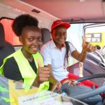 Wincate Wawira Wawira a 21 year old shopkeeper from Embu and also the winner of the ISUZU NMR TRUCK and Isuzu East Africa Sales Manager corporate Aid and Development Rose Mombo pose for a photo during Jaza Raha Na Shell Shinda Nyumba promotion handover ceremony at the New Embu Shell service station in Embu county.