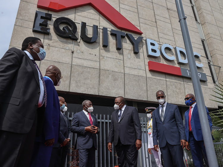 President Uhuru Kenyatta with Equity Group CEO James Mwangi and other officials when he presided over the official inauguration of the rebranded Equity BCDC office block in Central Kinshasa in April 2021. [Photo /PSCU]