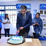 Mr. Manoj Agarwal, Vice President - Export Business - Daikin India AirConditioning Private Ltd (middle) cutting a cake commemorating the launch of Daikin operations in the country.