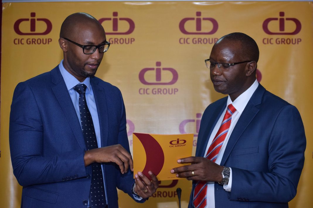 Philip Kimani – Group Chief Financial Officer (GCFO) (left), CIC Group discusses with Patrick Nyaga - Group Chief Executive Officer (GCEO), CIC Group (right) during the investor briefing and the announcement of the CIC Group 2021 results.