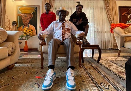 ODM leader Raila Odinga pictured with social media influencer and sneaker seller Nairobi West Niccur (Right) in October 2021. [Photo/ @RailaOdinga]