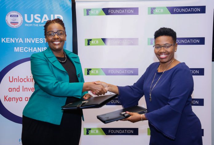 IMAGE-10 Head of KCB Foundation, Caroline Wanjeri (right), and USAID’s Kenya Investment Mechanism Acting Chief of Party, Dr. Grace Mwai (left) exchange the signed Memorandum of Understanding (MOU).