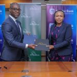 Head of Business and Commercial clients Stanbic Bank, Florence Wanja (R) Group Director of Business Development African Guarantee Fund Frank Adjagba (L) during the signing of the agreement between Stanbic Bank and Africa Guarantee Fund.