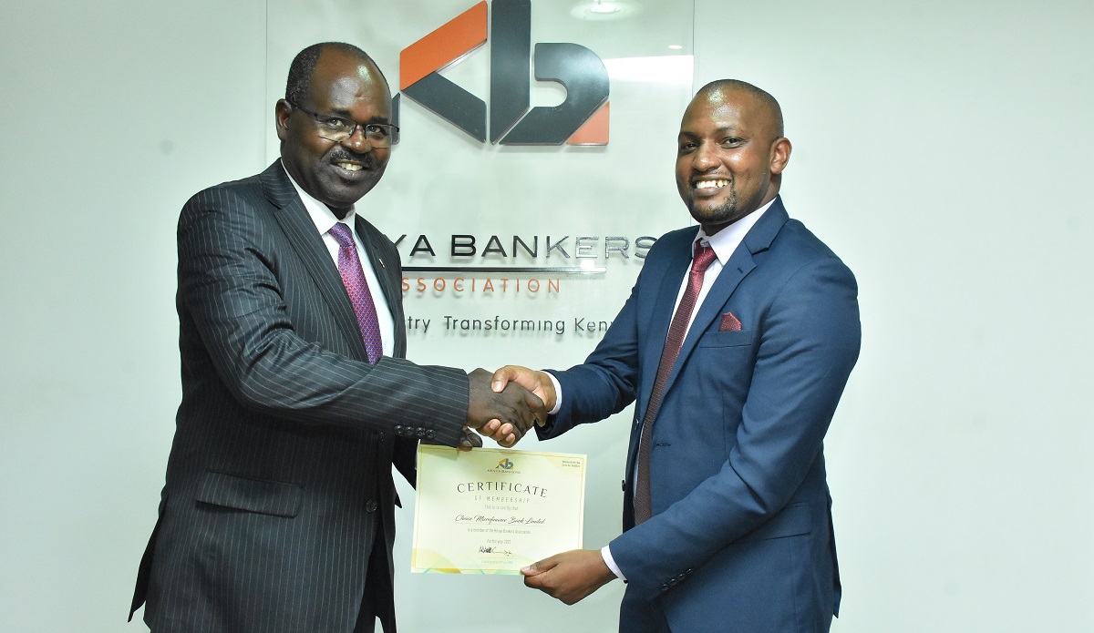 Choice Microfinace Bank - KBA CEO Dr. Habil Olaka Presents Choice Microfinace Bank Joseph Ndung'u a membership certificate following the lenders' joing of KBA's membership