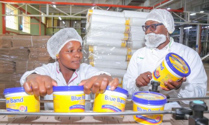 Upfield Blueband Upfield Head of Manufacturing Simon Ndegwa (R) and Mercy Kathure (L) showcase the production process during activities to mark World Food Safety Day. The theme for this year is Safer food, better health