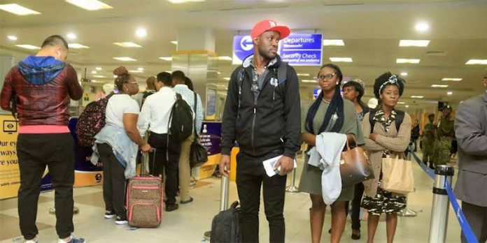Travellers pictured at the Jomo Kenyatta International Airport (JKIA). [Photo/ NMG]