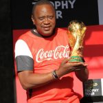 President Uhuru Kenyatta poses with the FIFA World Cup trophy. This year's tournament in Qatar will be live on KBC. [Photo/ PSCU]
