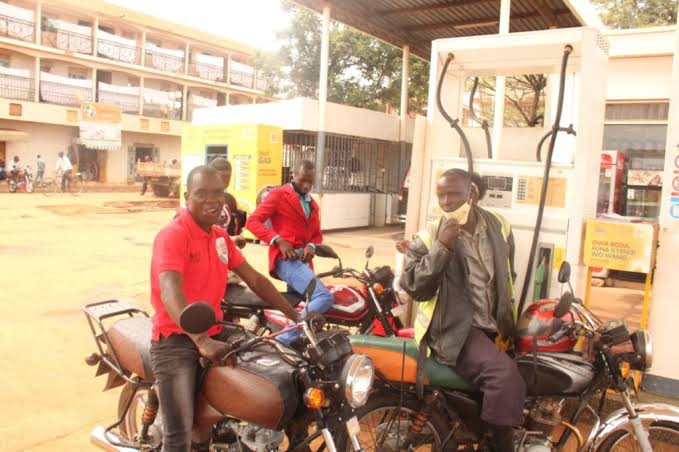 Boda boda riders at a fuel station in Kenya. Farmers, manufacturers and service providers are likely to pass on the increased cost of fuel to consumers. [Photo/ The County]