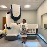 KUTRH Board Chairperson Prof. Olive Mugenda poses with the CyberKnife machine. [Photo/ @OliveMugenda]