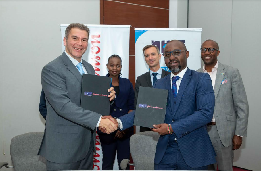 Asgar Rangoonwala, Senior Vice President for Emerging Markets at Janssen Pharmaceuticals Companies(left) and Dr Peter Kamunyo CEO NHIF exchange copies of the signed MoU during the partnership launch at Radisson Blu hotel