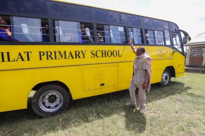 Former President Uhuru Kenyatta pictured on October 16, 2022 when he donated a schoolbus to Partakilat Primary School in Narok, delivering on a promise he made while still in office.
