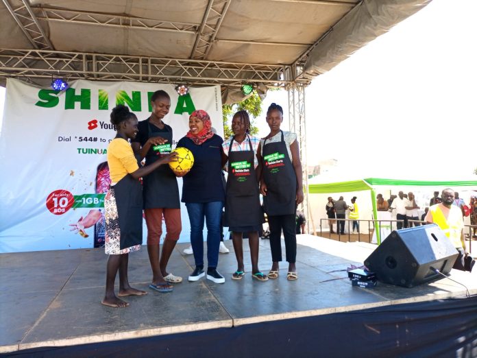 Fawzia Ali Kimanthi, Safaricom's Mobile Tribe Lead engages customers at the launch of the Youtube Shorts Campaign launch in the Western region.