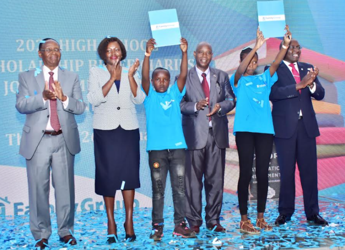 The Family Bank Chair Dr.Wilfred Kiboro, CEO Rebecca Mbithi, Director Of Education Dr. Chacha Mwita, The Family Group Foundation Chairman Dr. Francis Muraya (R) & two of the 302 high school beneficiaries during the 2023 commissioning of the KES 60 million programme for bright but needy students.