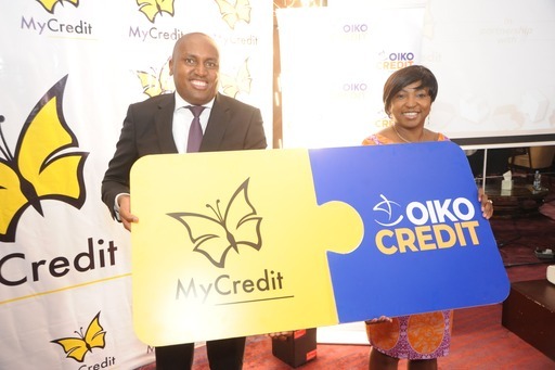(L-R) MyCredit Managing Director Mr Wangaruro Mbira Receives Cheque From OikoCredit Regional Director Africa Region Caroline Mulwa during the signing agreement for ksh. 325 million from OikoCredit to MyCredit for onward lending to SMEs who are are doing trading business.