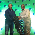 Overall men winner Emmanuel Nyakaberia receives his prize from KCB Group Director ICT Simon Mbogo at the Vetlab Golf Club during the KCB East Africa Golf Tour yesterday evening.