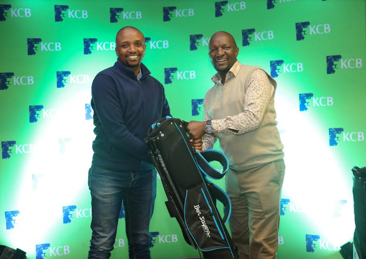 Overall men winner Emmanuel Nyakaberia receives his prize from KCB Group Director ICT Simon Mbogo at the Vetlab Golf Club during the KCB East Africa Golf Tour yesterday evening.