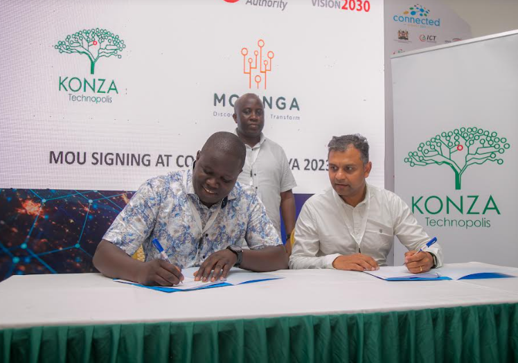 KoTDA Ag. CEO John Okwiri (l) with Moringa School CEO Snehar Shah (r) during the signing of the MoU. Looking on is ICT PS, Eng. John Tanui.