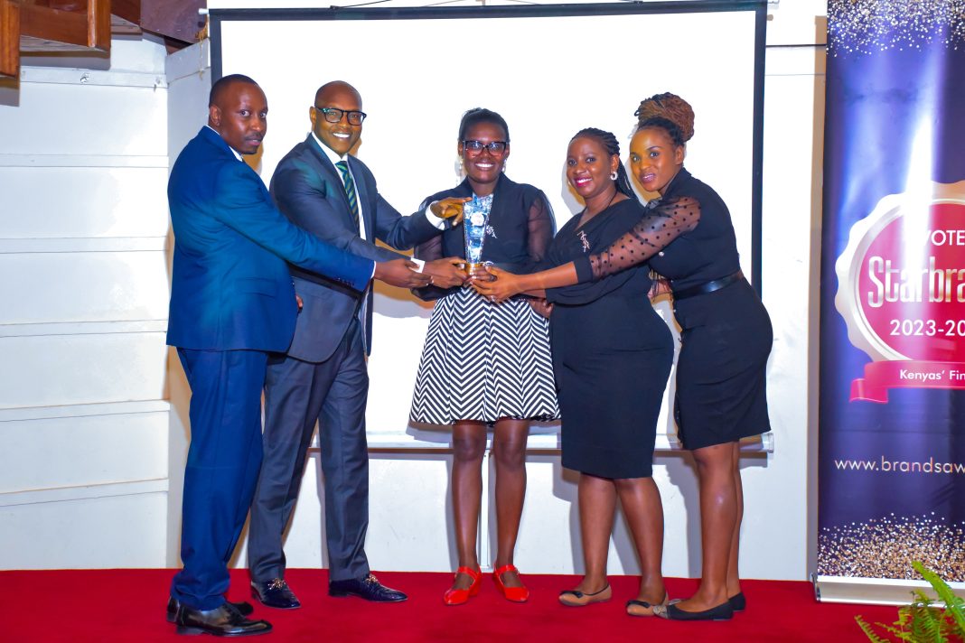 Username Investments Team receiving a trophy as the top Real Estate Land Seller in East Africa during Starbrands Awards