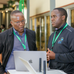 Mr Charles Nzioka from Cisco, one of the top sponsors of the Cyber Security Summit 2023, explains the importance of malware security in an organization to Anthony Mutwiri at the conference. [ Photo: Courtesy ]