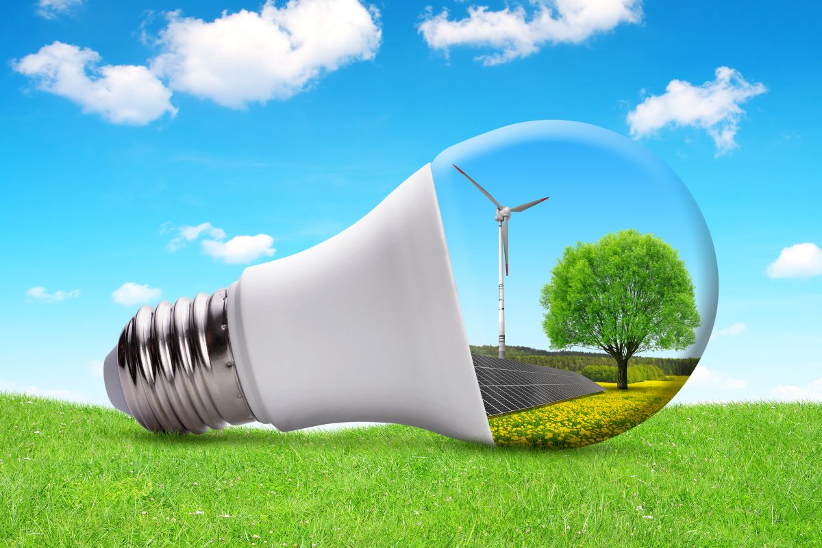 Eco LED light bulb with solar panel and wind turbine.