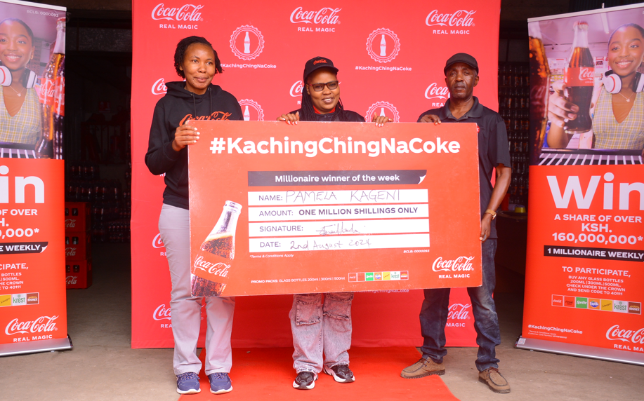 (L-R) Regional Trade Marketing Manager Nairobi, Coca- Cola Bottlers Kenya, Shilah Shitanda, Ksh 1Million winner Pamela Kageni from Nairobi and Area Sales Manager, Eastleigh District, Coca-Cola Bottlers Kenya, Ben Momanyi during the presentation of a cheque to one of the winners of the Kachingching na Coke campaign. [Photo/Courtesy]