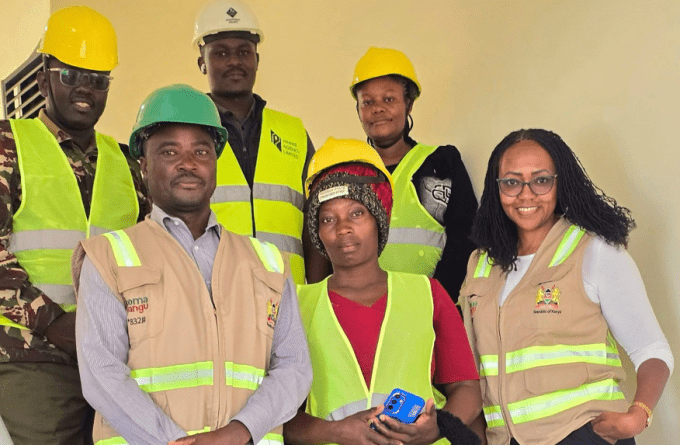 Milka Moraa with Affordable Housing Board officials