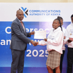 Communications Authority Director General David Mugonyi awards the finalists.
