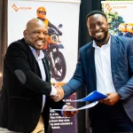 Electric Motorcycles - Official document handover by Bernard Mwonyonyo and Habib Lukaya