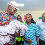 Joseph Ogutu, Chairman of the Safaricom Foundation, together with H.E. Dr. Ochilo G.M. Ayacko, Governor of Migori County, congratulate new mother Ronica Akinyi as they interact with her newborn at the newly inaugurated Mother and Child Wing of Awendo Sub-County Hospital. The facility, officially handed over to the community, is expected to play a vital role in reducing maternal deaths and improving access to quality healthcare services across the region