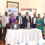 KNNCI and KPDA officials during the MoU signing