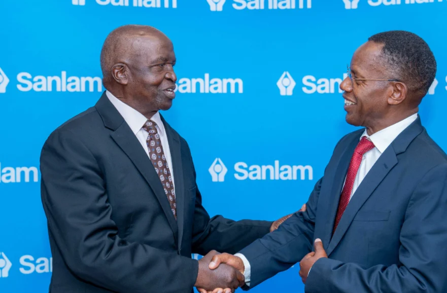 Sanlam Kenya PLC Chairman Dr John Simba (left) shares a light moment with the company's Group CEO Dr Patrick Tumbo.