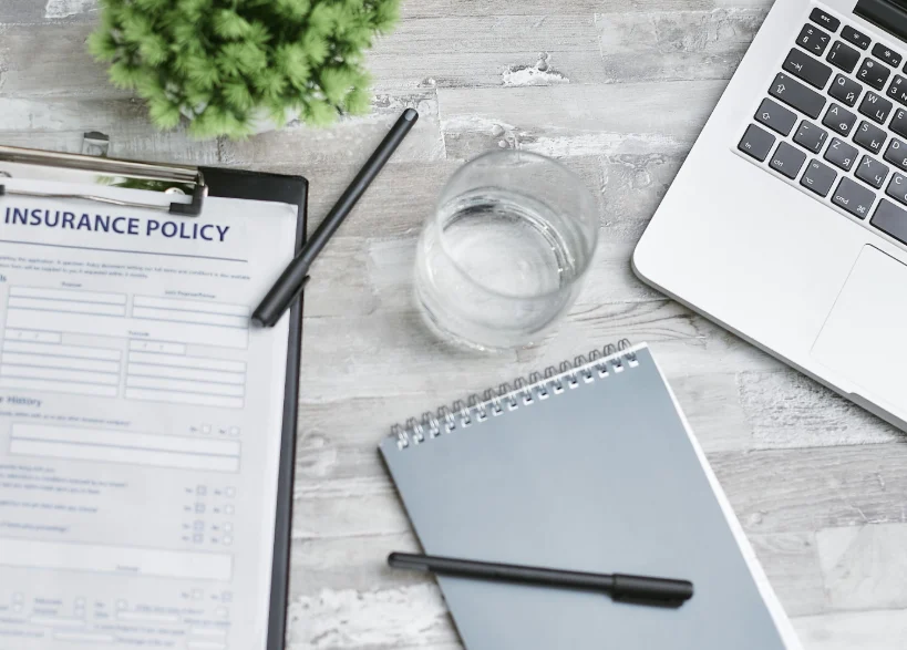 A notebook and laptop on the table