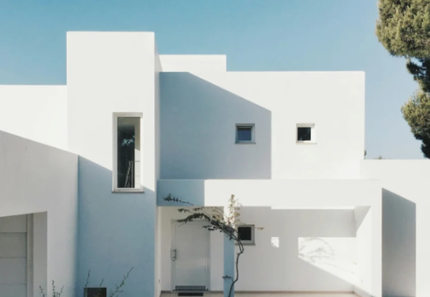 White 2-storey house near trees. PHOTO/Pexels