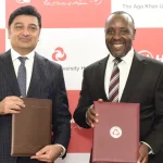 Aga Khan University Hospital CEO Rashid Khalani and KQ CEO Allan Kilavuka during the signing of a medical tourism partnership aimed at enhancing medical travel for patients across Africa