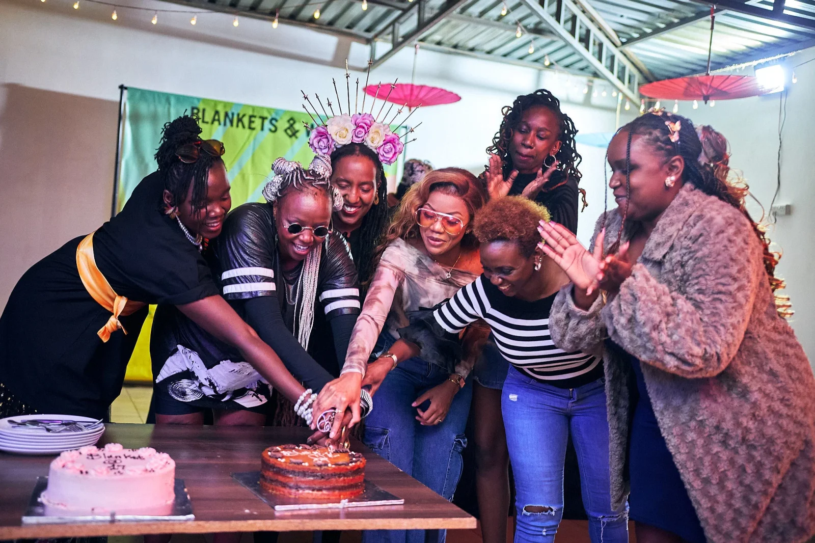 Blankets and wine team cutting a cake during the 17 year birthday