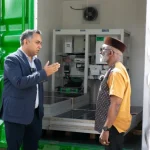 Ayush Gupta, Director, Global Strategy and Business Anglophone Africa, Schneider Electric, and Sam Ebale, Director Don Bosco Development Outreach Network during the handover ceremony of a containerized Villaya Solar Microgrid Solution from Schneider Electric to Don Bosco Korr