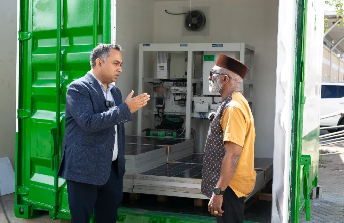 Ayush Gupta, Director, Global Strategy and Business Anglophone Africa, Schneider Electric, and Sam Ebale, Director Don Bosco Development Outreach Network during the handover ceremony of a containerized Villaya Solar Microgrid Solution from Schneider Electric to Don Bosco Korr