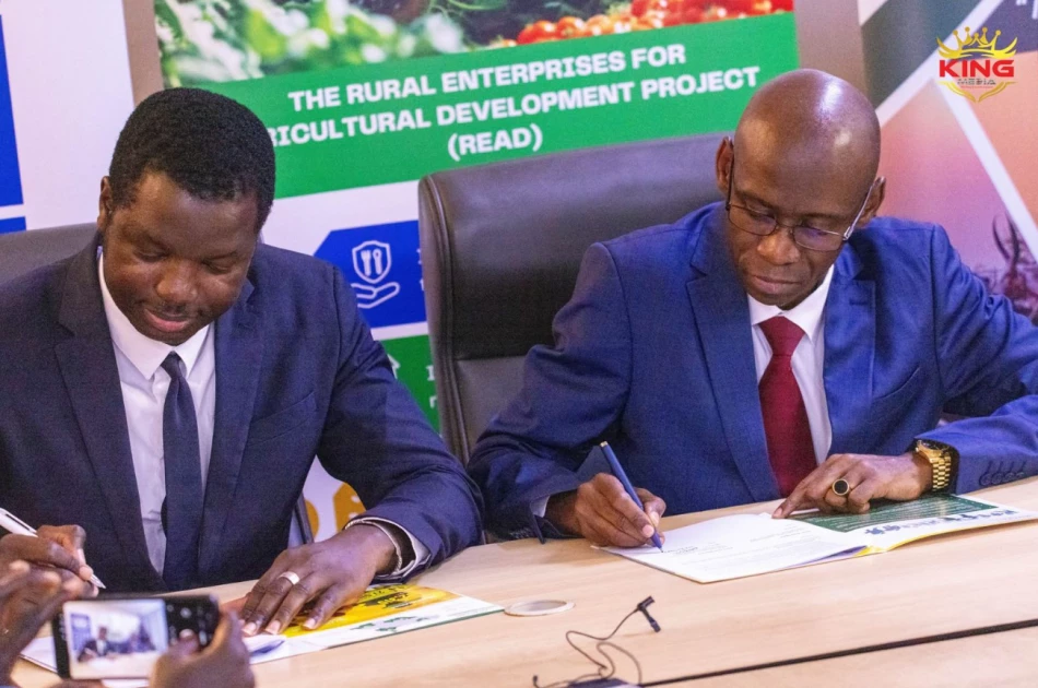 Ligane Sene, Deputy Representative and Senior Economist for UNDP in South Sudan sign-off the Workplan documents for the $20 million Rural Enterprise and Agriculture Development (READ) project with Elijah Wamalwa, the Managing Director Co-operative Bank of South Sudan.