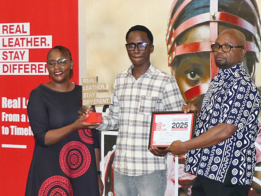 Stephen Maosa receives People's Choice Award from ALLPI, Executive Director, Nicholas Mudungwe at RLSD Africa