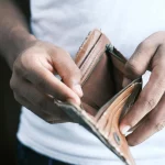 Person Holding an Empty Wallet