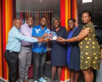 Absa Bank Kenya Chief People Officer Mumbi Kahindo (3rd from right) leads the Absa team in receiving the Award