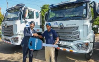 From Left- Managing Director, CFAO Mobility Kenya, Arvinder Reel and Managing Director, Africa Global Logistics Kenya, Martin Mwangi during the official handover of 32 Sinotruk NX Prime Movers to Africa Global Logistics Company.