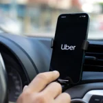 Uber driver checking phone. PHOTO/Pexels