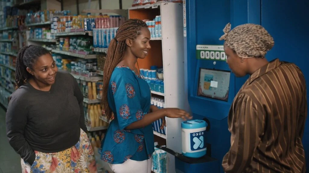A customer in Nairobi tops up on clean fuel at a KOKO Fuel ATM 1024x576