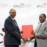 KNCCI President Dr Erick Rutto with Cyrell Wagunda Odede, Principal Secretary, State Department for Public Investments and Assets Management during the KNCCI AGM in Nairobi on Thursday.